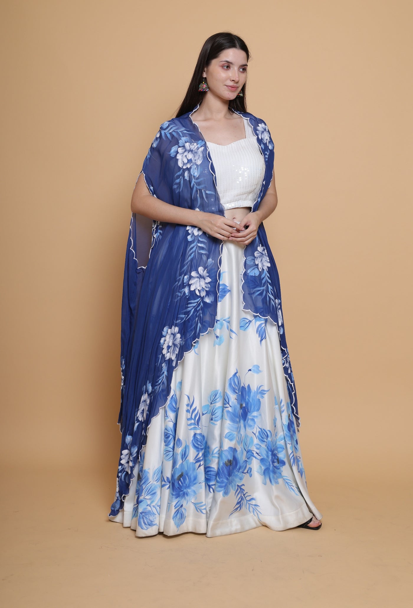 Destiny By Anjali Celestial Elegance White Hand Painted Skirt Top Set with Blue Cape - Unique Designer Ensemble for Special Occasions."