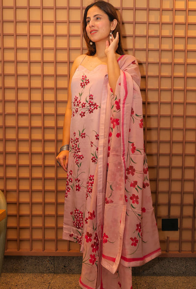 Experience the beauty of nature with Floral Desire. This hand painted and hand embroidered suit features a stunning floral design on imported armani satin fabric. With a delicate noodle strap neckline, this suit is a true masterpiece from designer brand Destiny by Anjali. Elevate your style and embrace the art of nature.