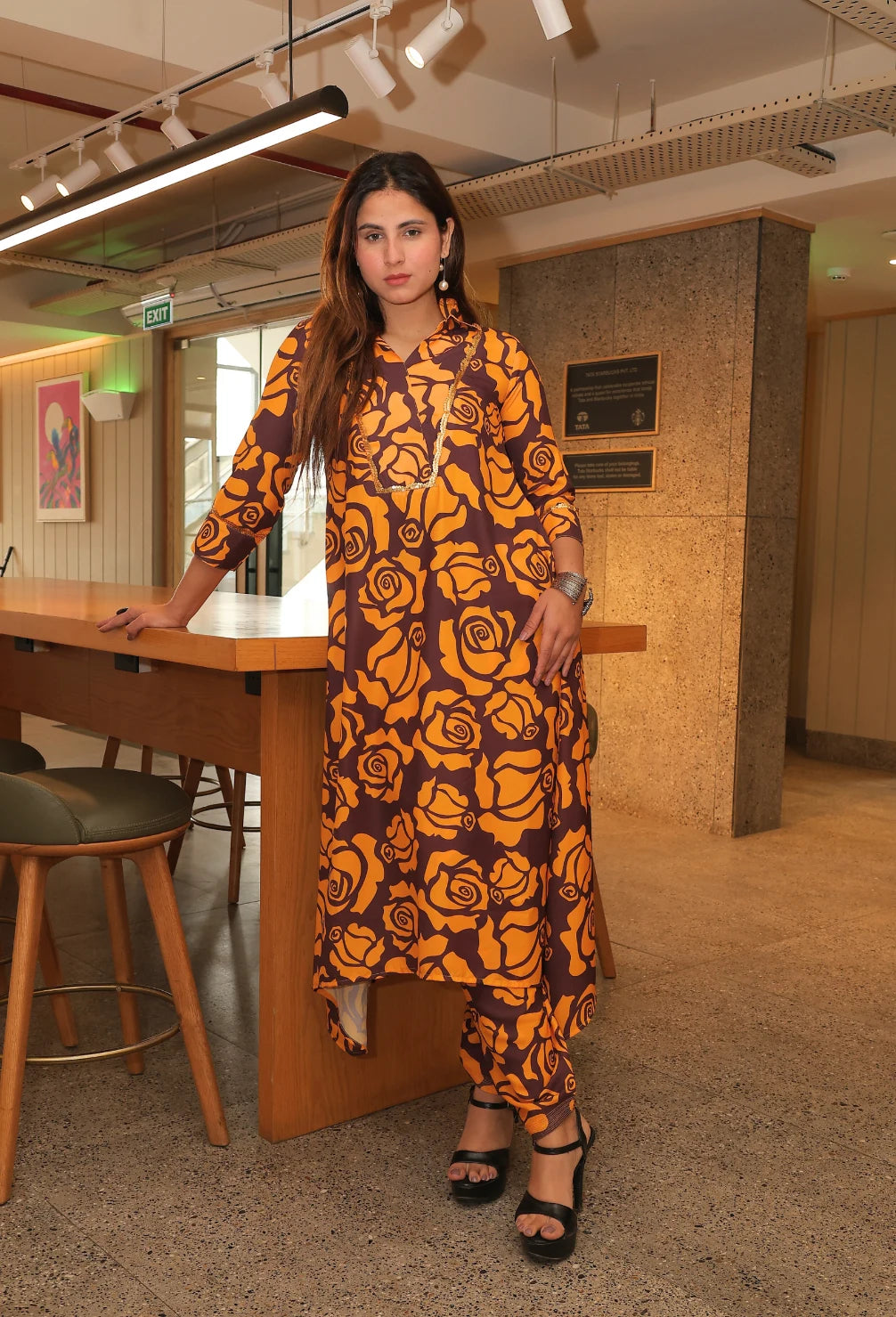 Elevate your summer wardrobe with the Saffron Fauna - Tunic Kurti Set. This exquisite tunic style set is made with double georgette fabric, perfect for the warm weather. With its exquisite floral print and coffee and mustard color combination, it exudes elegance and never goes out of style. From the luxurious brand Destiny by Anjali.